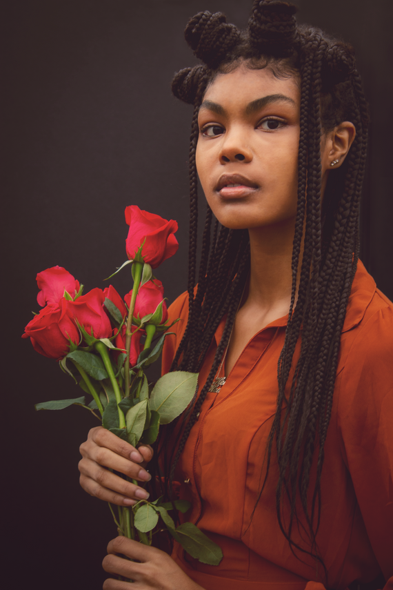 A Woman Holding Roses