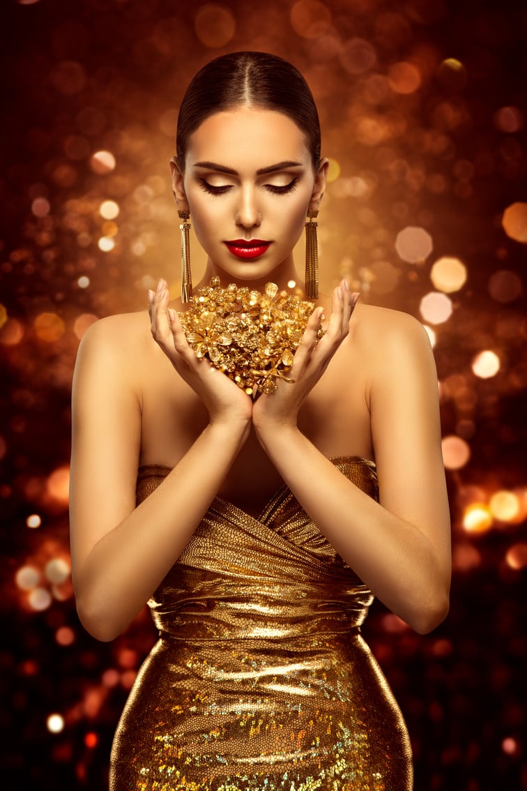 Woman in Holding Golden Heart in Golden Dress